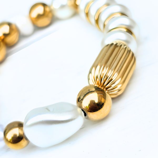 Statement armband in goud en met parels